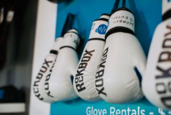 boxing gloves hanging in a row