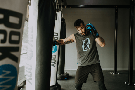 Man punches a punching bag