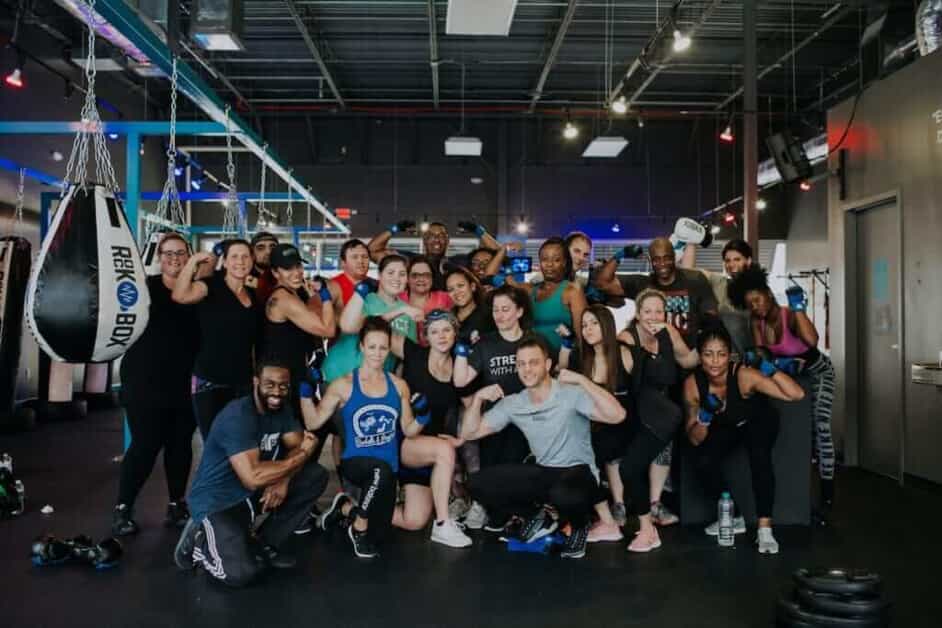 Group flexes their muscles at a RockBox gym