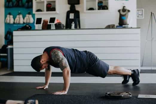 A man performs a push up