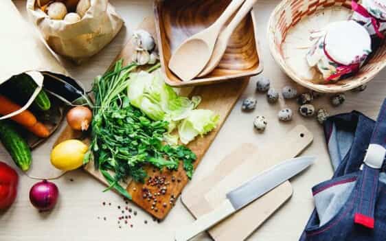 Ingredients and cooking supplies laid out on a table