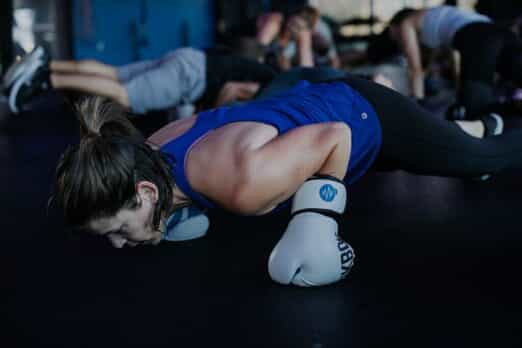 A woman performs a push up