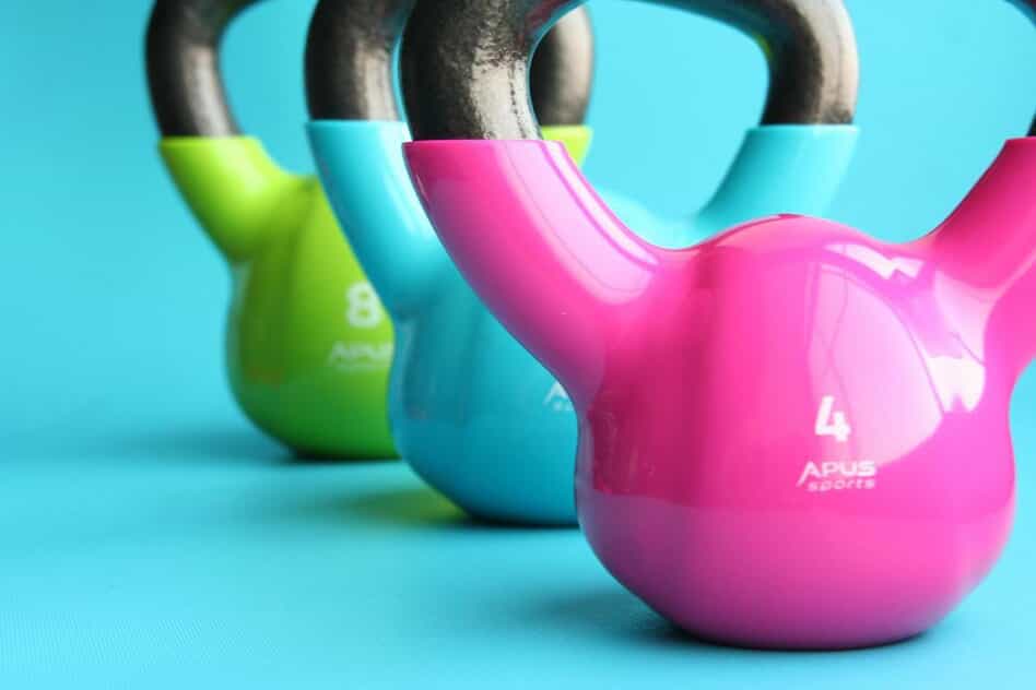 Three colorful kettlebells