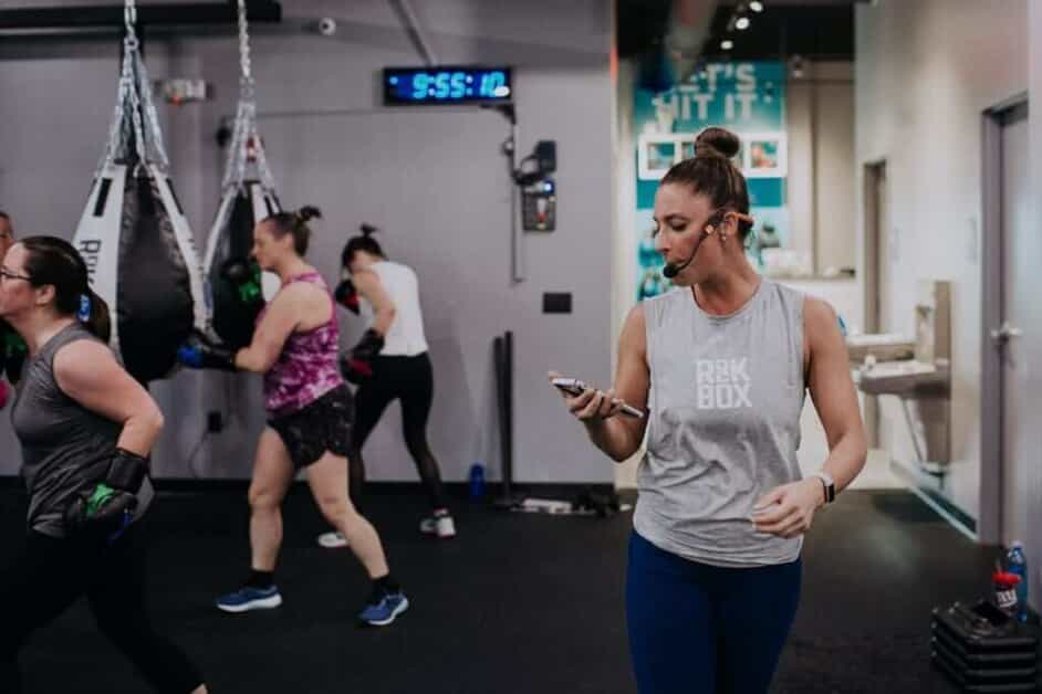 Woman coaches a rockbox class