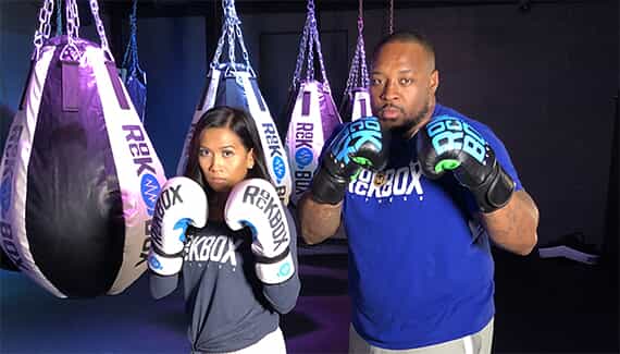 Shia and Mike Tolbert pose with RockBox gloves