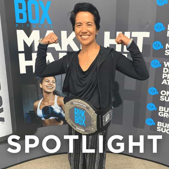 rockbox franchise owner tina ching poses with a boxing belt